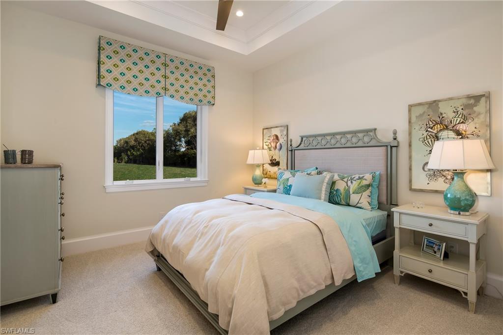 6818 Mangrove Avenue Naples, FL 34109 - Photo 4 of 24 a bedroom with a bed and a window