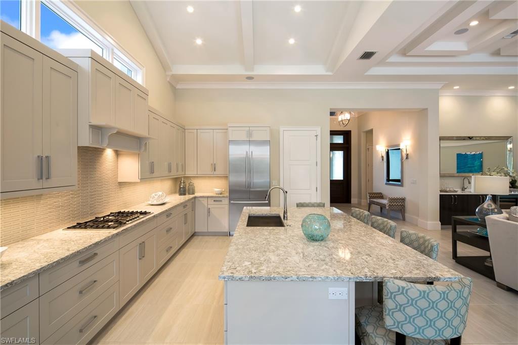 6818 Mangrove Avenue Naples, FL 34109 - Photo 7 of 24 a large kitchen with granite countertop a lot of counter space