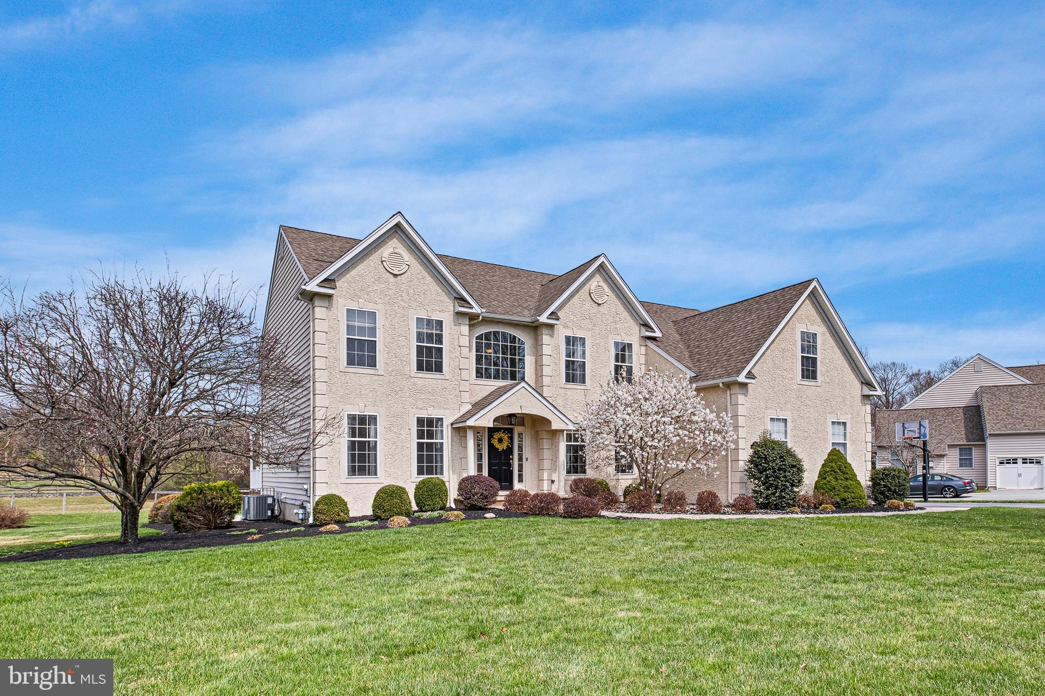 26 Woodside Farm Road Garnet Valley, PA 19060 - Photo 15 of 57 a view of a house with a big yard and large trees