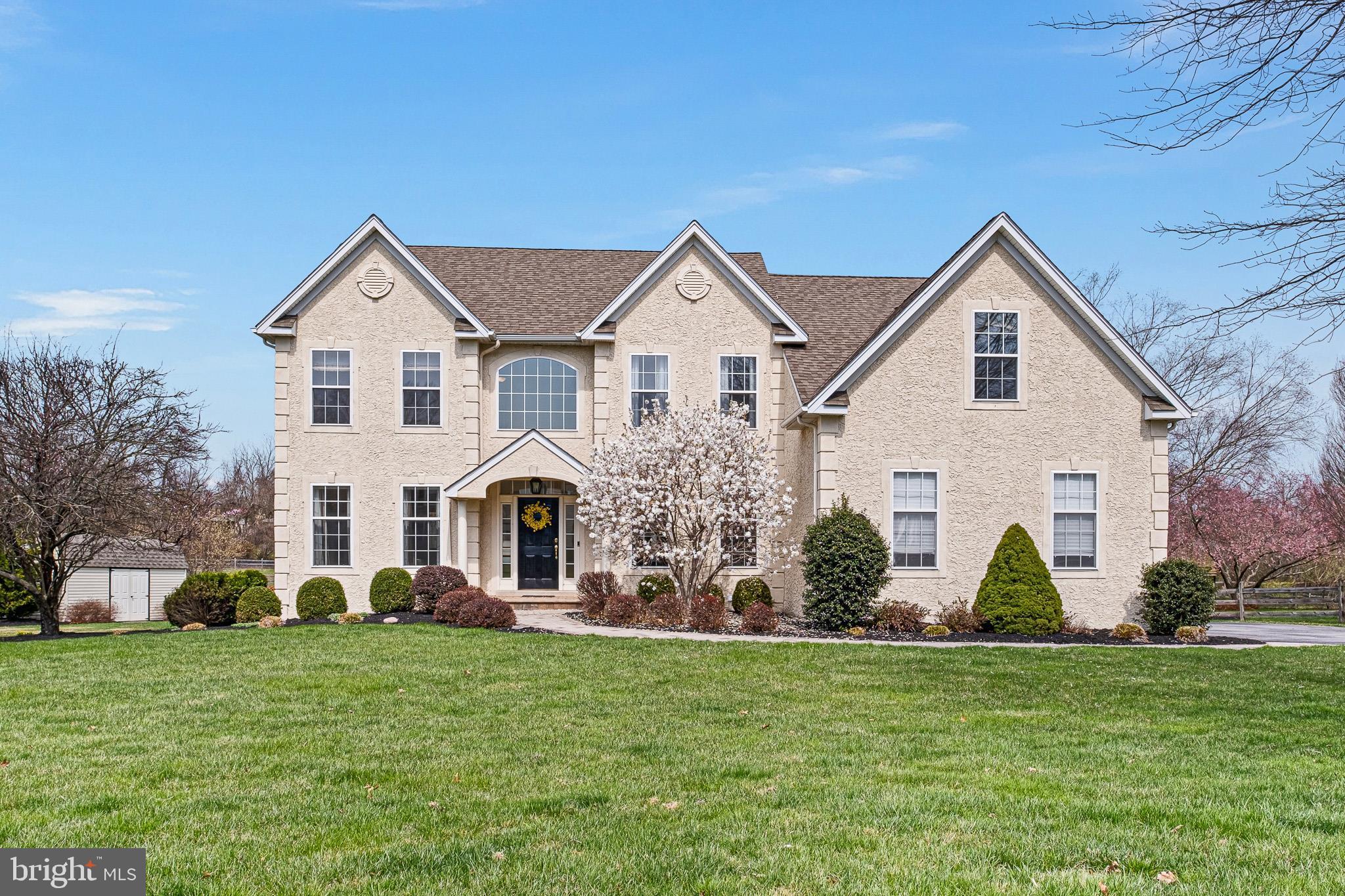 26 Woodside Farm Road Garnet Valley, PA 19060 - Photo 16 of 57 a front view of house with yard and green space