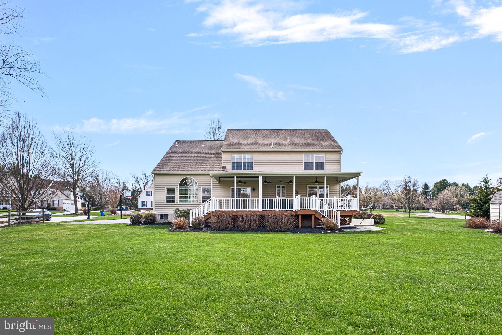 26 Woodside Farm Road Garnet Valley, PA 19060 - Photo 17 of 57 a front view of a house with a garden and trees