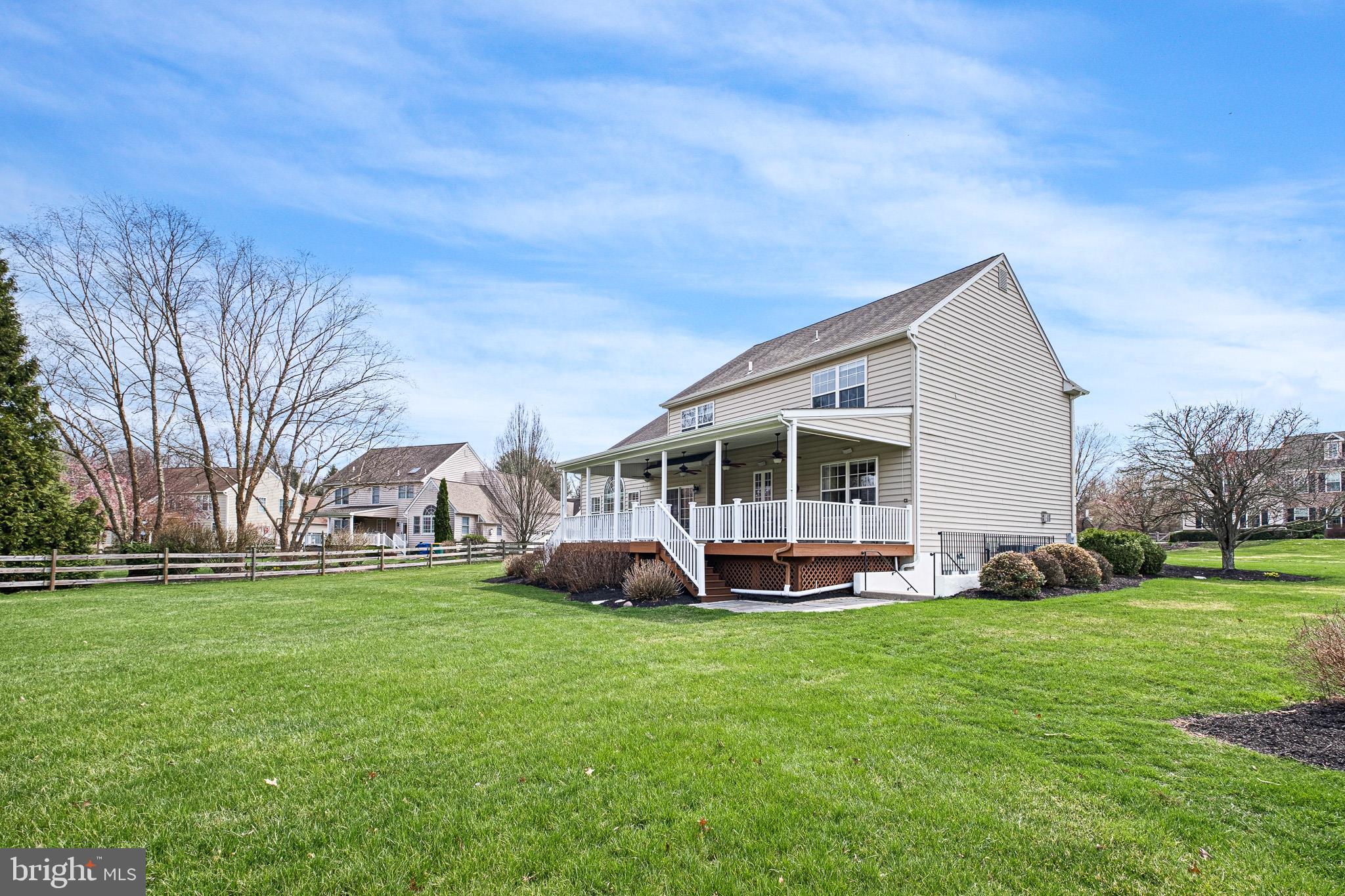 26 Woodside Farm Road Garnet Valley, PA 19060 - Photo 18 of 57 a view of a house with a big yard and large trees