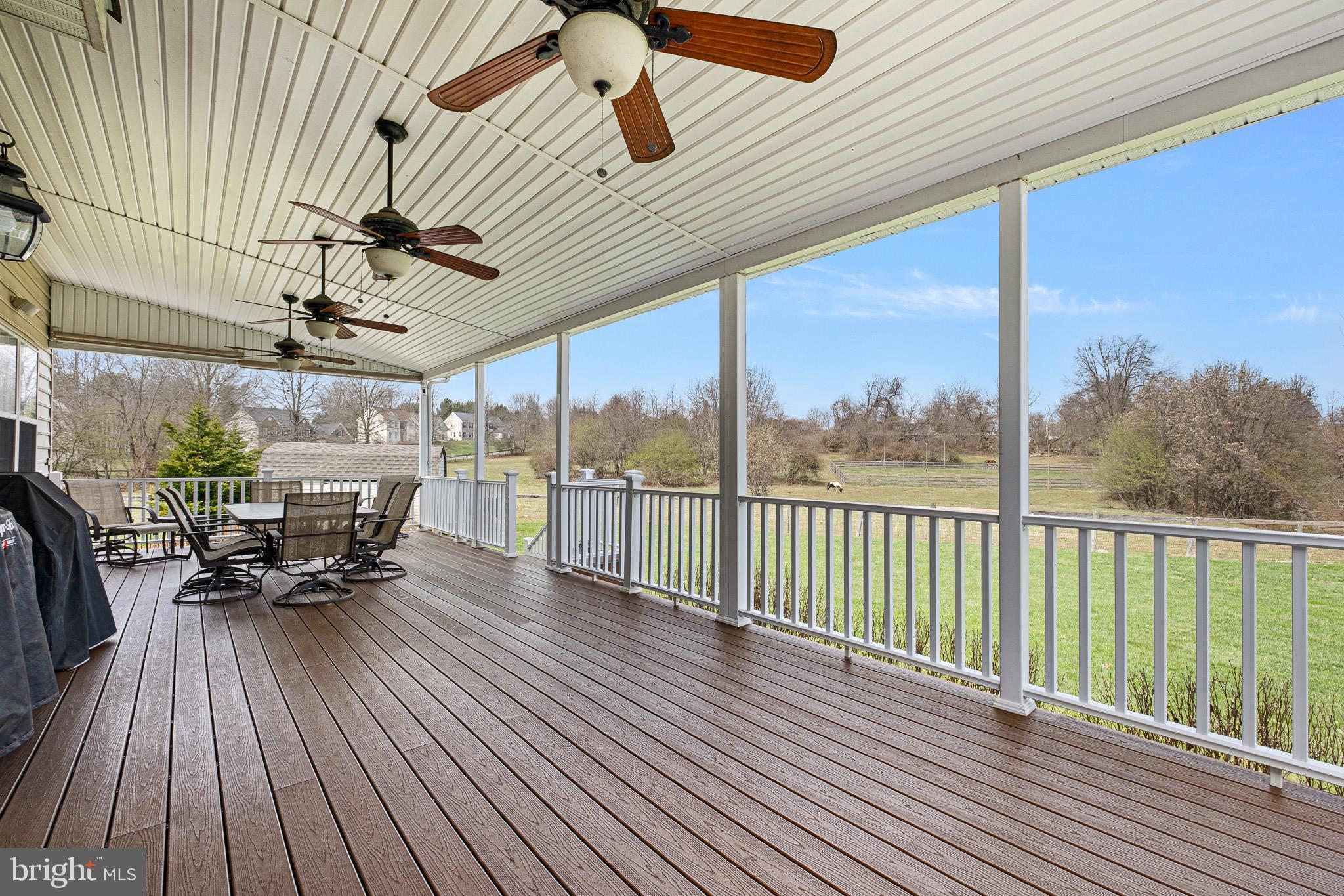 26 Woodside Farm Road Garnet Valley, PA 19060 - Photo 22 of 57 a view of a patio with table and chairs and wooden floor