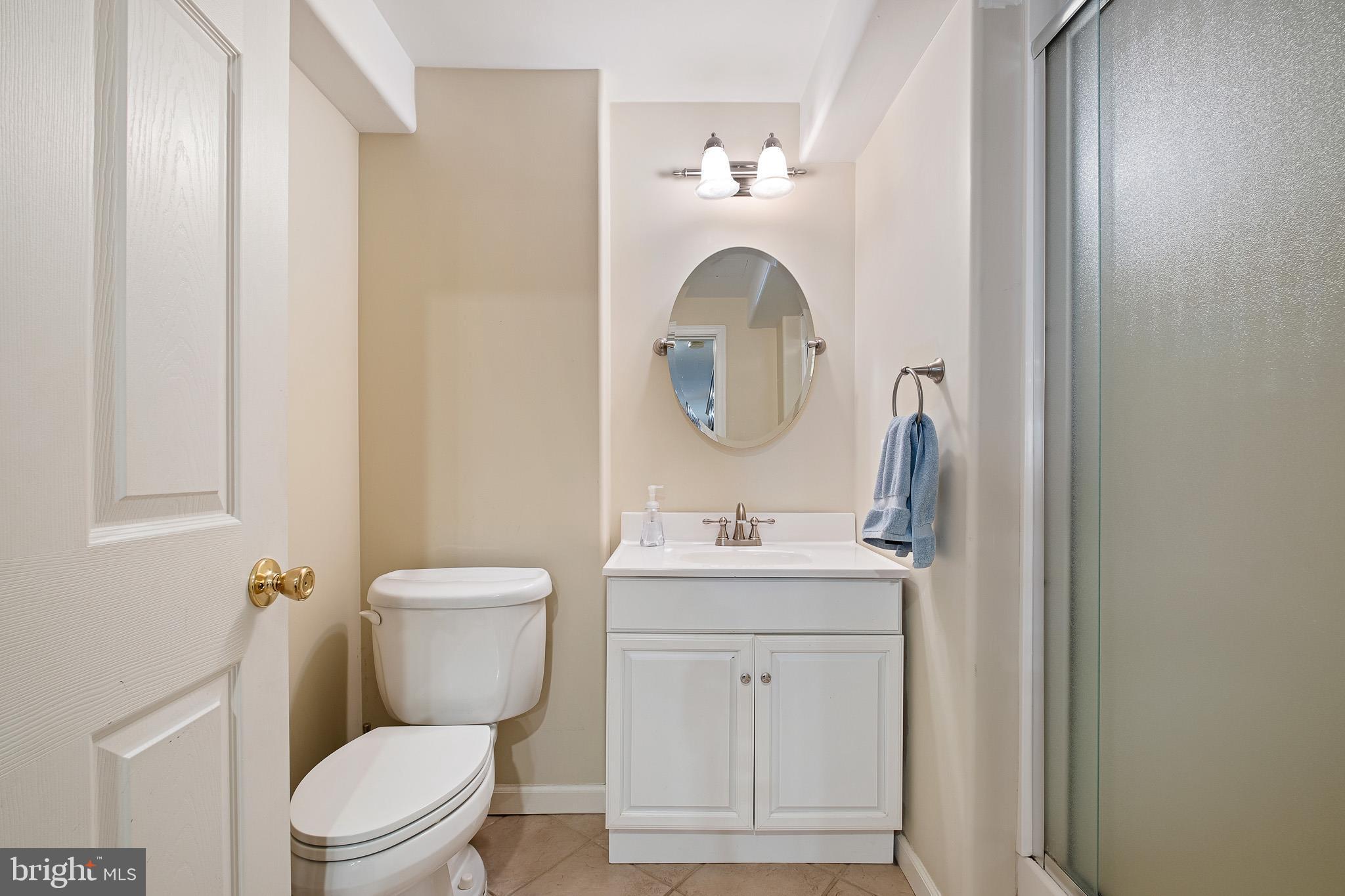 26 Woodside Farm Road Garnet Valley, PA 19060 - Photo 23 of 57 a bathroom with a toilet a sink and mirror