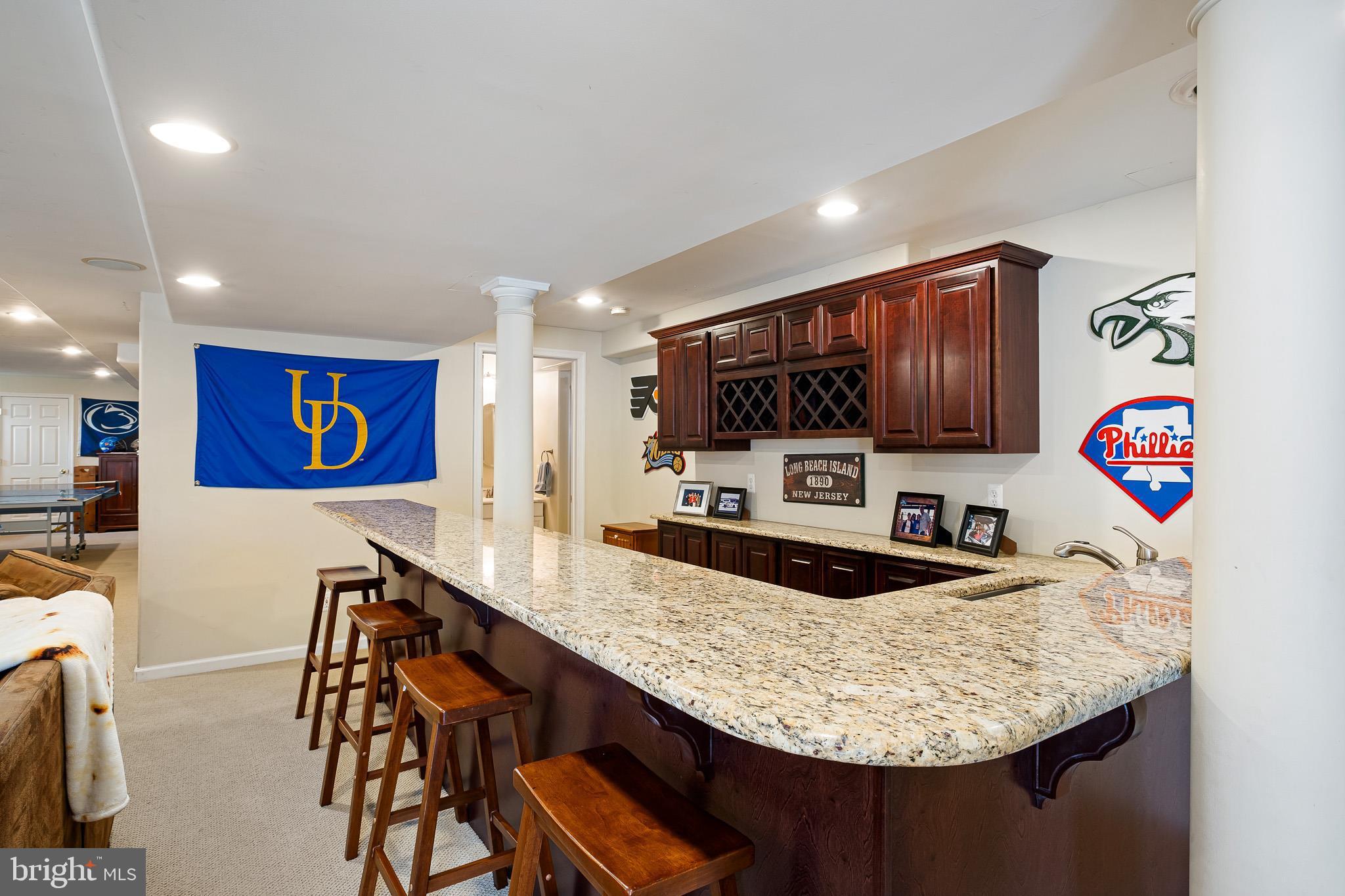 26 Woodside Farm Road Garnet Valley, PA 19060 - Photo 25 of 57 a kitchen with stainless steel appliances granite countertop a sink and a microwave