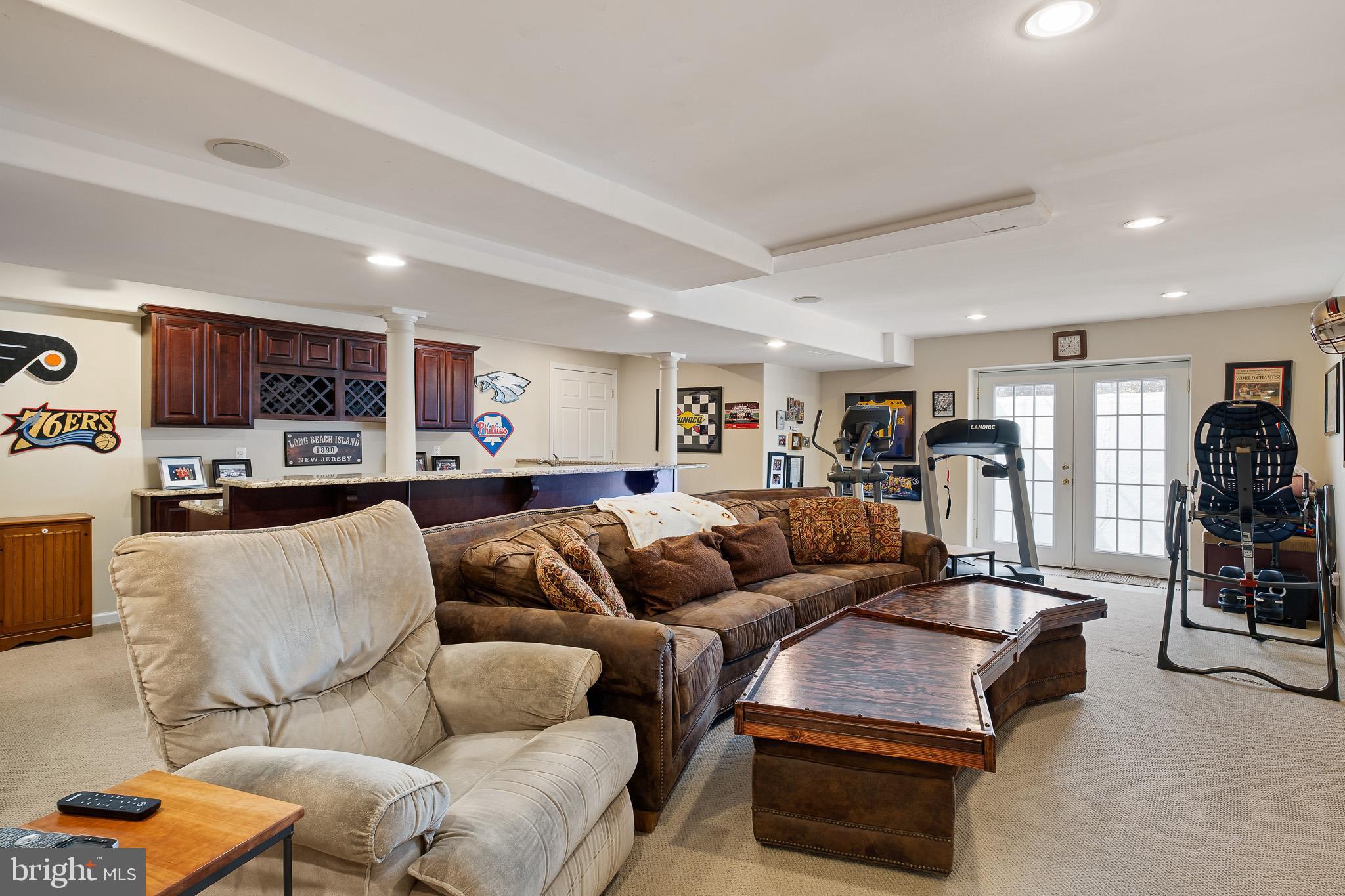 26 Woodside Farm Road Garnet Valley, PA 19060 - Photo 27 of 57 a living room with furniture kitchen and a wooden floor