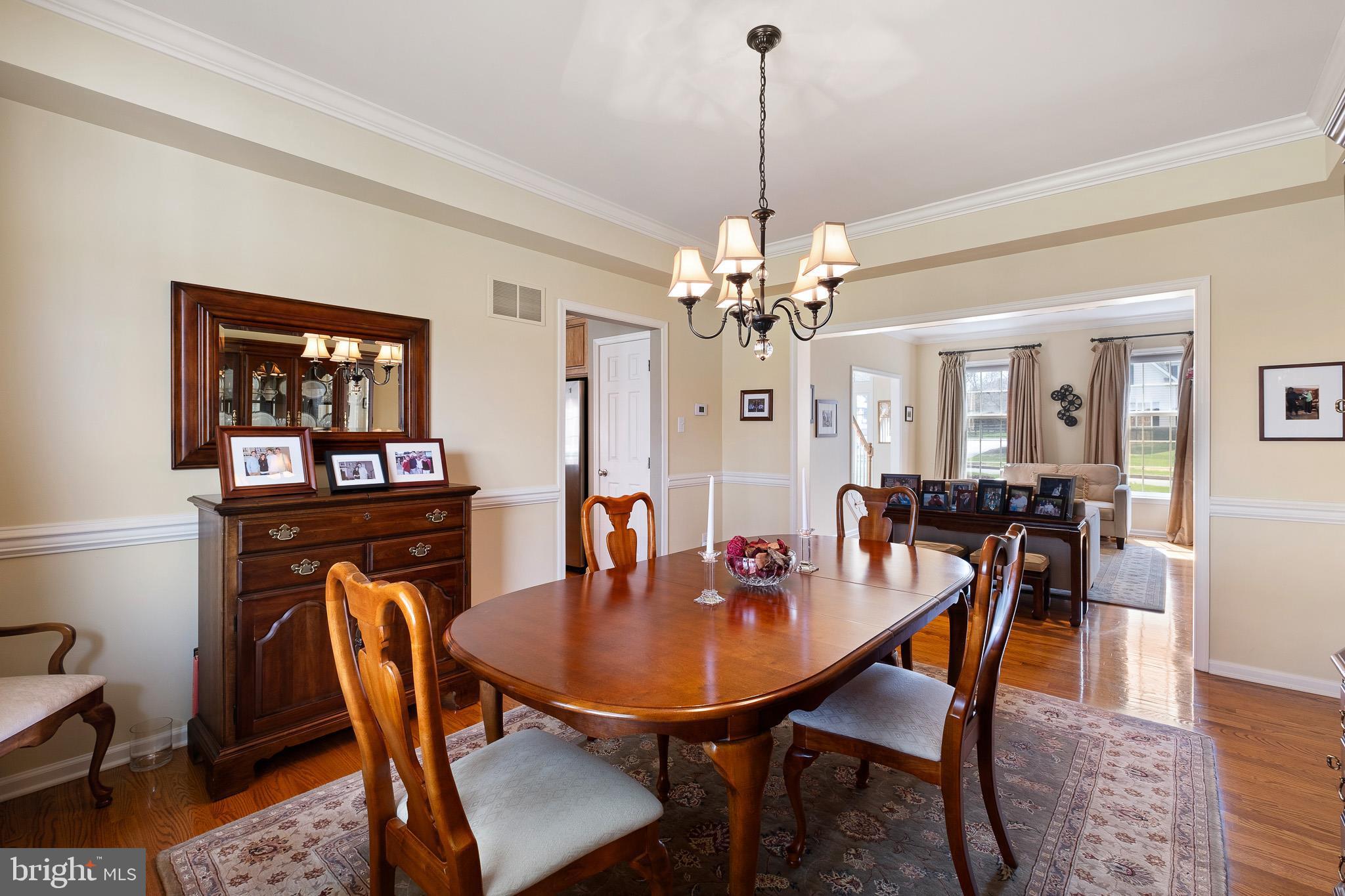 26 Woodside Farm Road Garnet Valley, PA 19060 - Photo 32 of 57 a view of a dining room with furniture and wooden floor