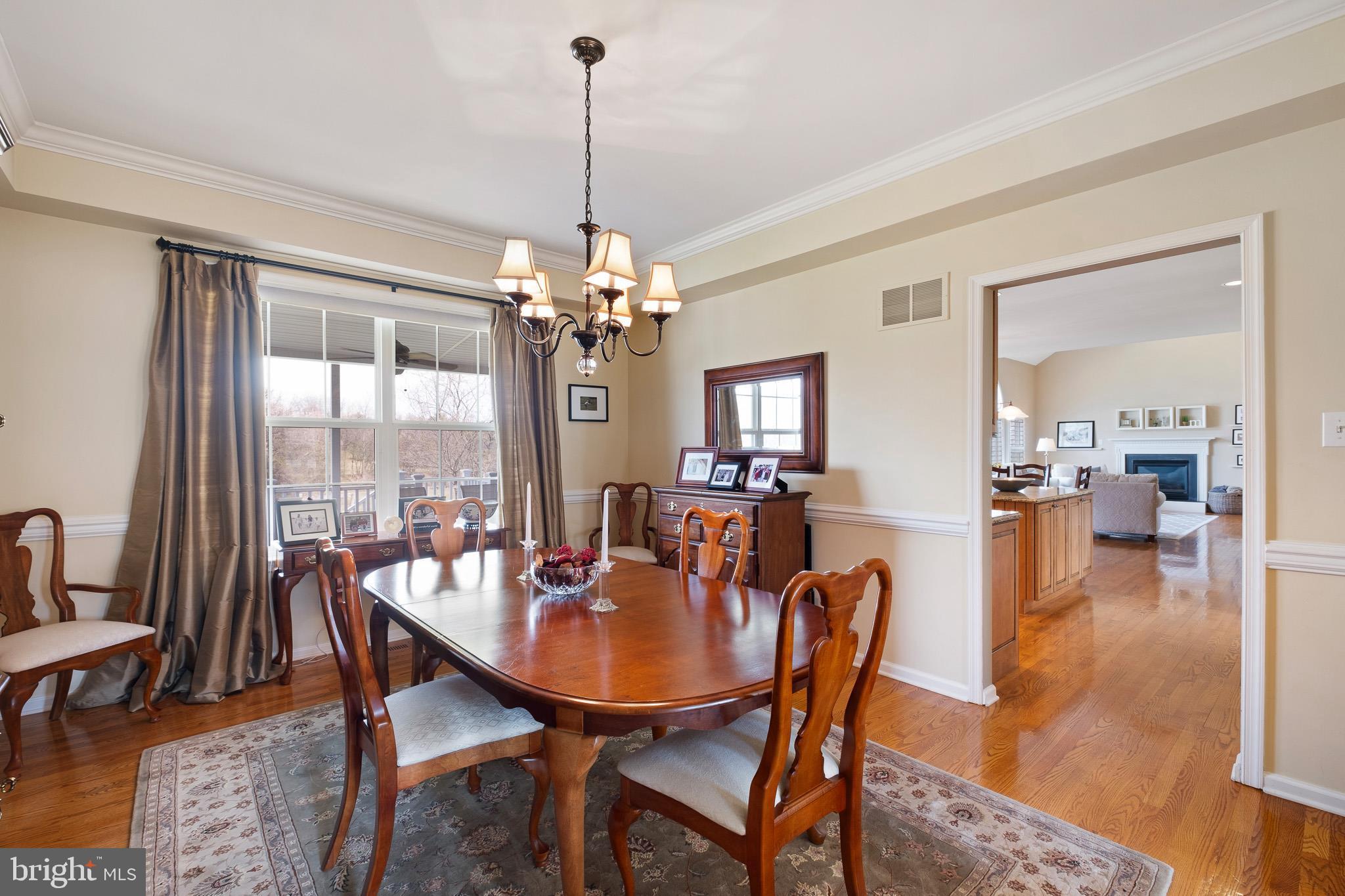 26 Woodside Farm Road Garnet Valley, PA 19060 - Photo 33 of 57 a view of a dining room with furniture window and wooden floor