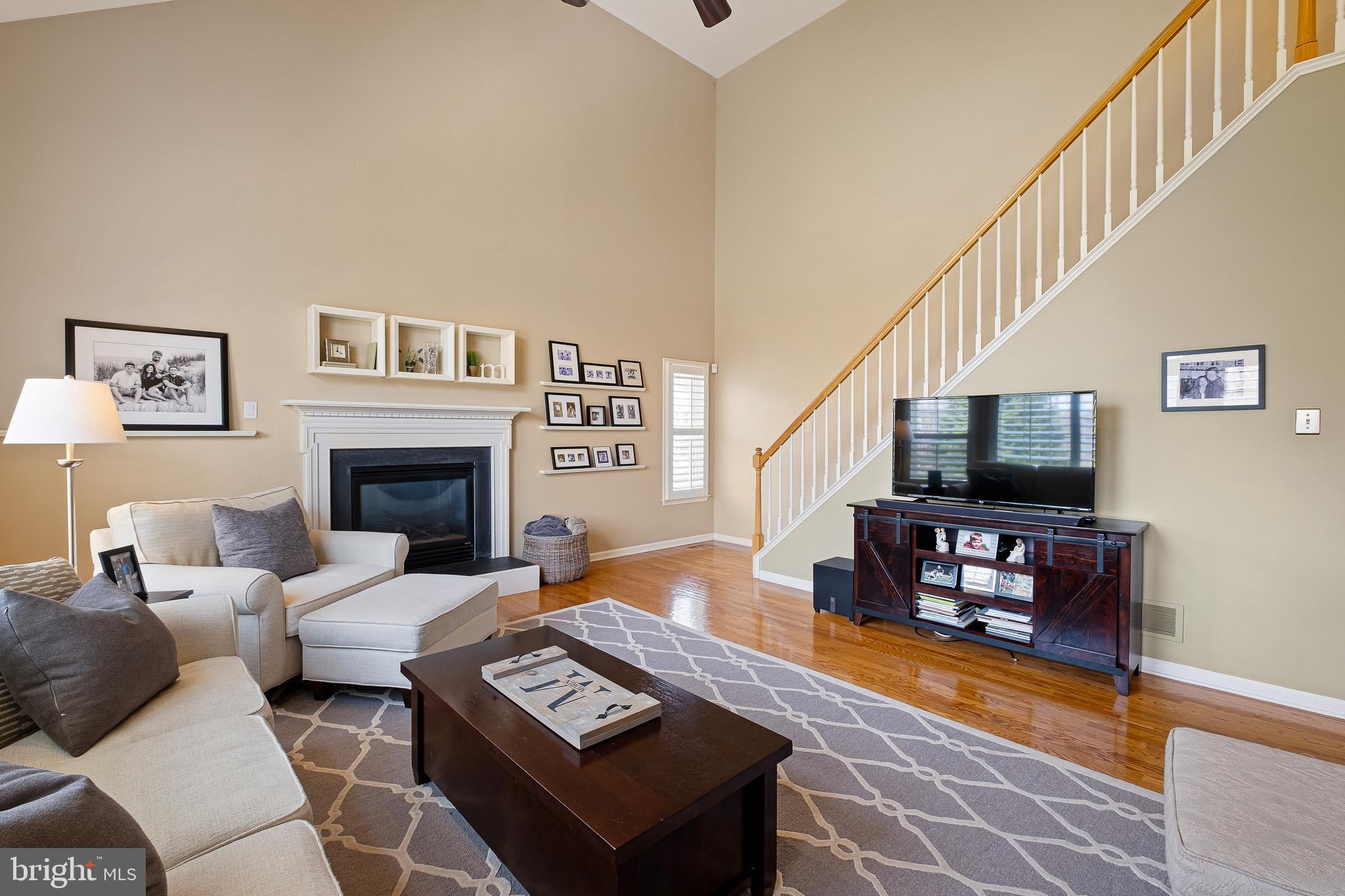 26 Woodside Farm Road Garnet Valley, PA 19060 - Photo 41 of 57 a living room with furniture and a fireplace