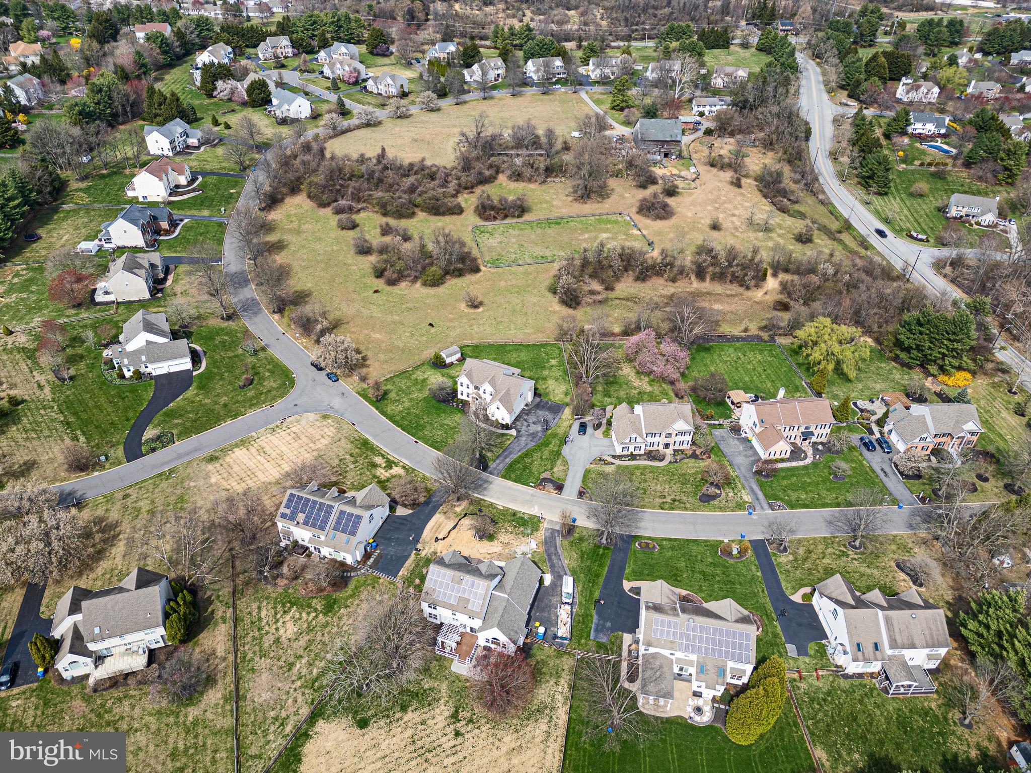 26 Woodside Farm Road Garnet Valley, PA 19060 - Photo 5 of 57 an aerial view of residential houses with outdoor space