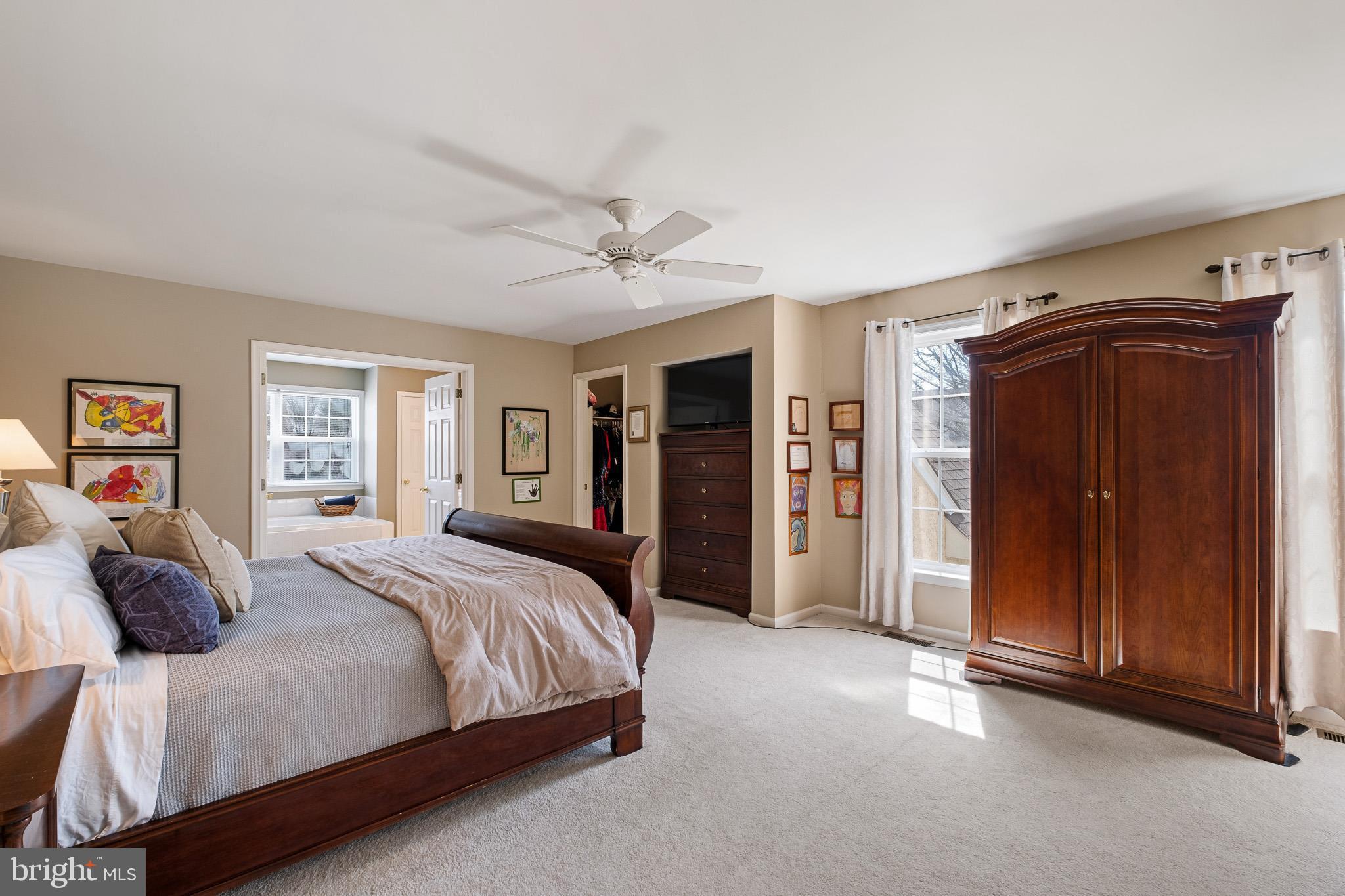 26 Woodside Farm Road Garnet Valley, PA 19060 - Photo 51 of 57 a bedroom with a large bed and a dresser