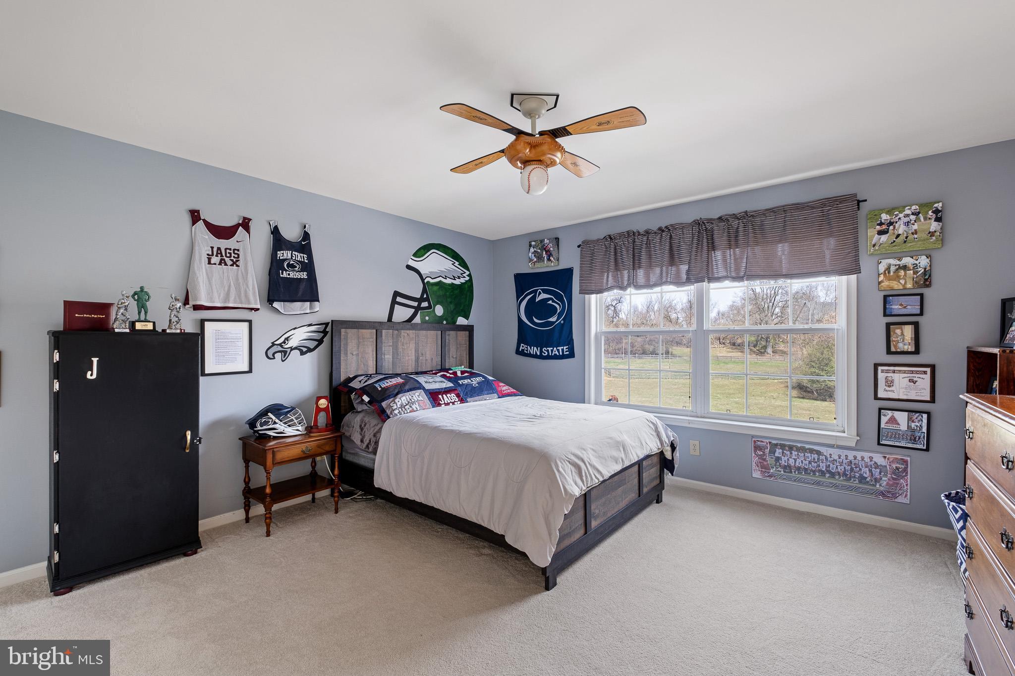 26 Woodside Farm Road Garnet Valley, PA 19060 - Photo 53 of 57 a bedroom with a bed and large window