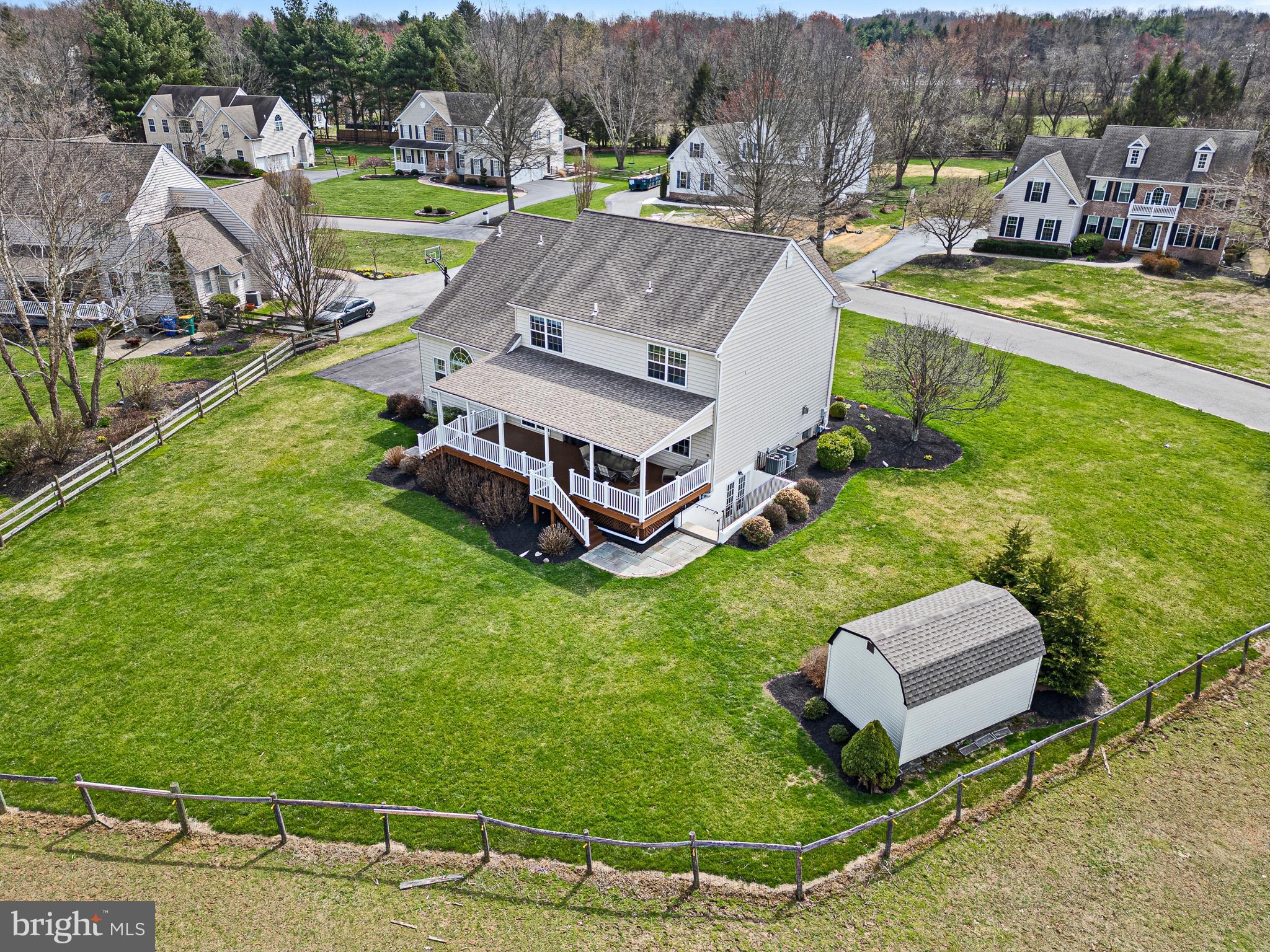 26 Woodside Farm Road Garnet Valley, PA 19060 - Photo 9 of 57 an aerial view of a house with a garden and swimming pool