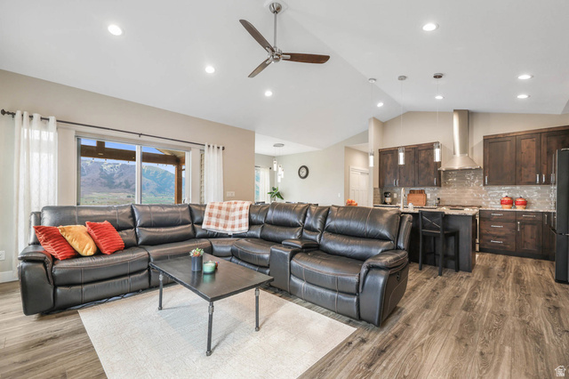 4527 North Seven Bridges Road Eden, UT 84310 - Photo 12 of 65 Living room featuring a ceiling fan, dark wood-style flooring, lofted ceiling, and recessed lighting