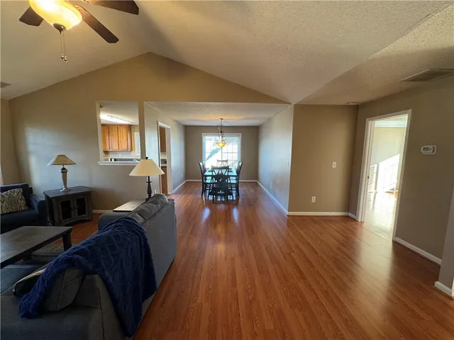 a kitchen with stainless steel appliances a stove a refrigerator and island