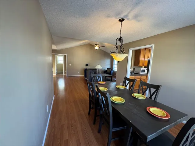 a view of a house with wooden deck