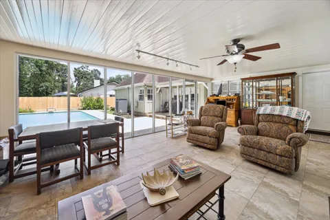 a living room with furniture and a large window