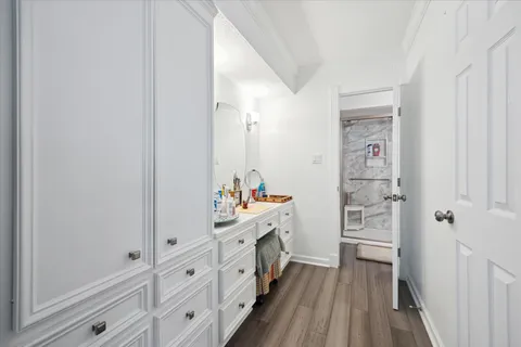 a bathroom with double vanity and mirrors
