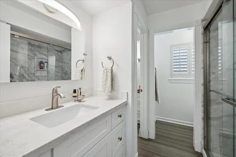 a bathroom with a double vanity sink mirror and double