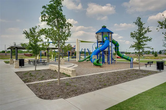 a view of a house with swimming pool and sitting area