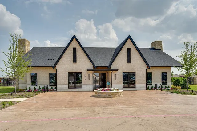 a view of a patio with a table and chairs