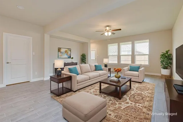 a living room with furniture and a window