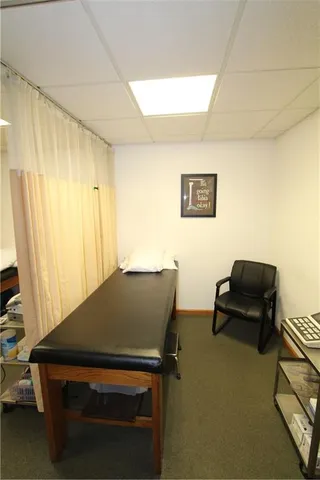 a view of workspace with furniture and window