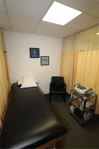 a bedroom with a bed and furniture