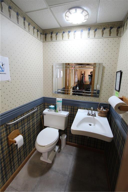 352 Railroad Street Ligonier, PA 15658 - Photo 5 of 28 a bathroom with a sink toilet and mirror