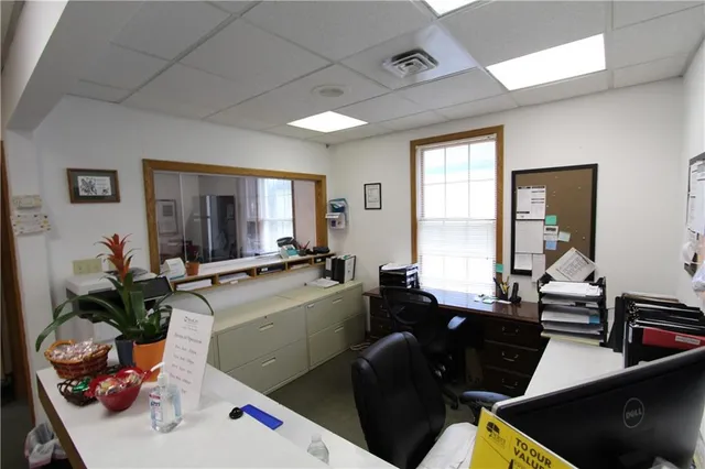 a room with furniture pool table and flat screen tv