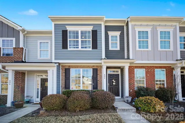 a view of a brick building with many windows