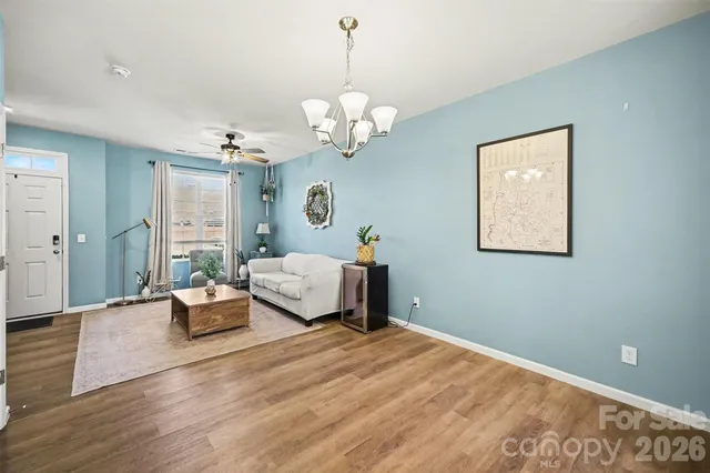 a bedroom with a bed mirror and couch