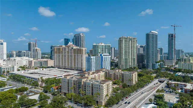 a view of a city with tall buildings