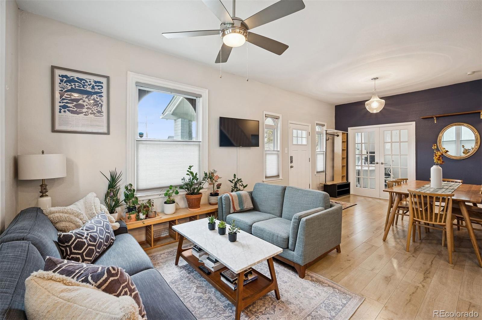 2109 West 41st Avenue Denver, CO 80211 - Photo 1 of 33 a living room with furniture and a wooden floor