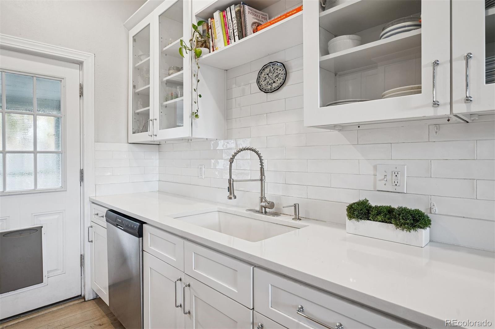 2109 West 41st Avenue Denver, CO 80211 - Photo 14 of 33 a close view of a sink and a stove in a kitchen