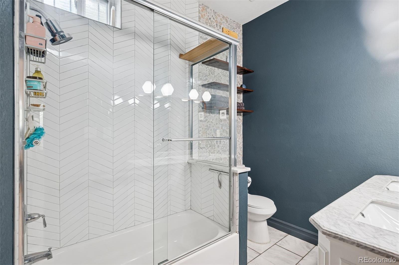 2109 West 41st Avenue Denver, CO 80211 - Photo 16 of 33 a bathroom with a shower