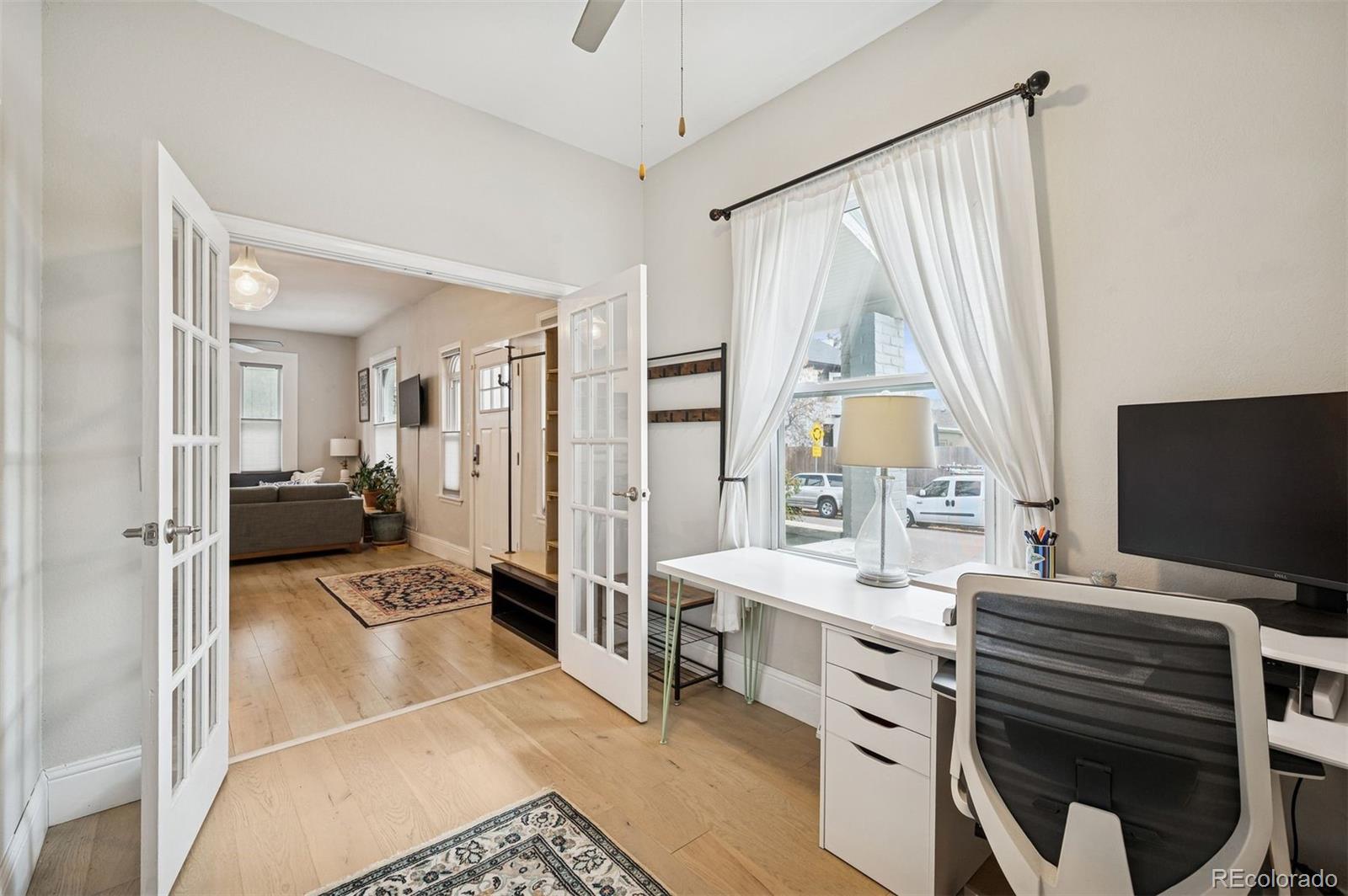 2109 West 41st Avenue Denver, CO 80211 - Photo 20 of 33 a bedroom with furniture and a flat screen tv