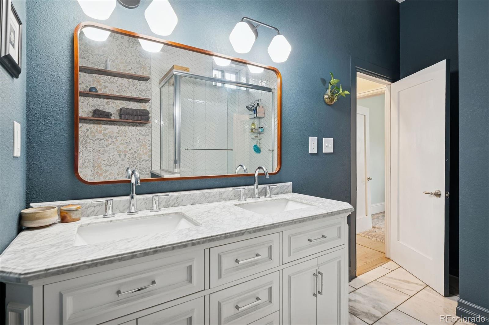 2109 West 41st Avenue Denver, CO 80211 - Photo 24 of 33 a bathroom with a granite countertop sink mirror and double