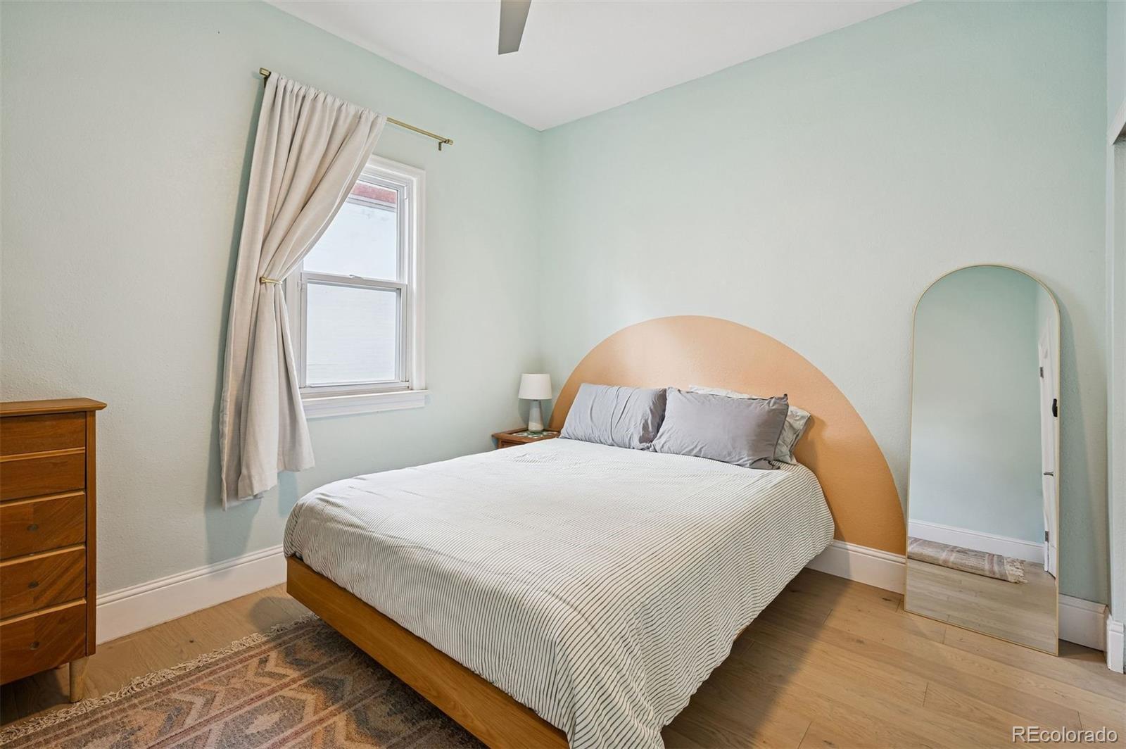 2109 West 41st Avenue Denver, CO 80211 - Photo 25 of 33 a bedroom with a bed and a window