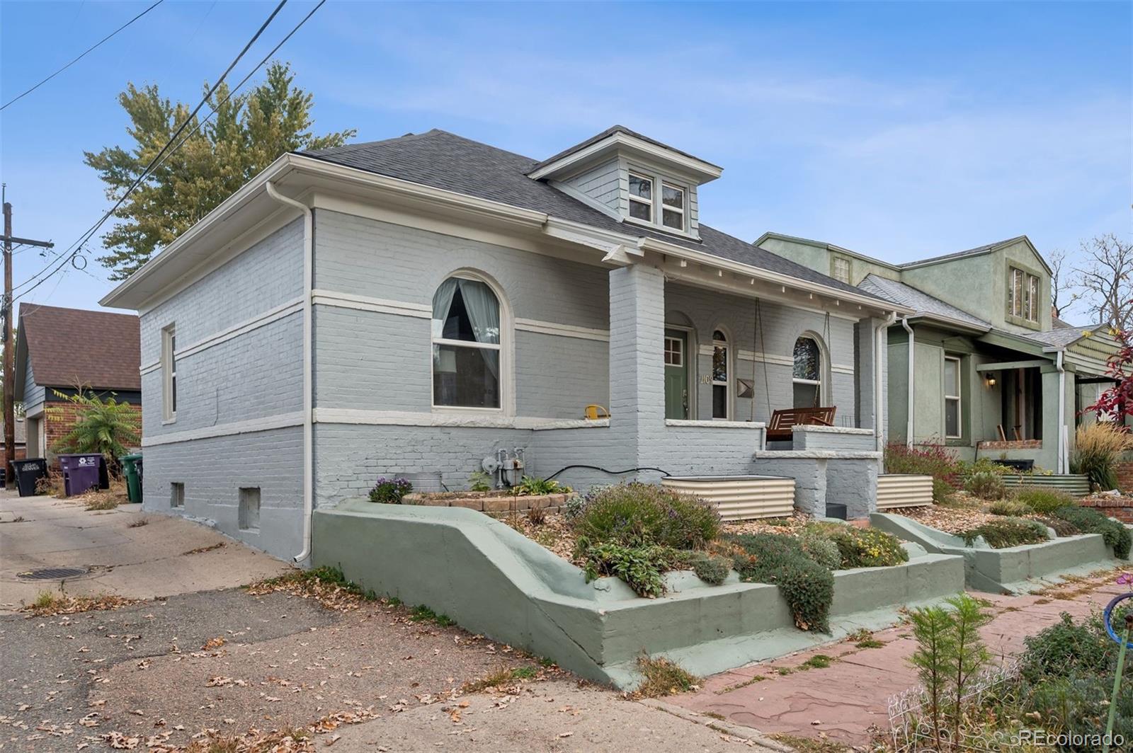 2109 West 41st Avenue Denver, CO 80211 - Photo 29 of 33 a front view of a house with garden