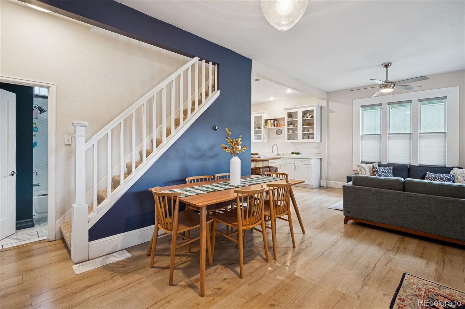 2109 West 41st Avenue Denver, CO 80211 - Photo 9 of 33 a view of a livingroom with furniture wooden floor and windows