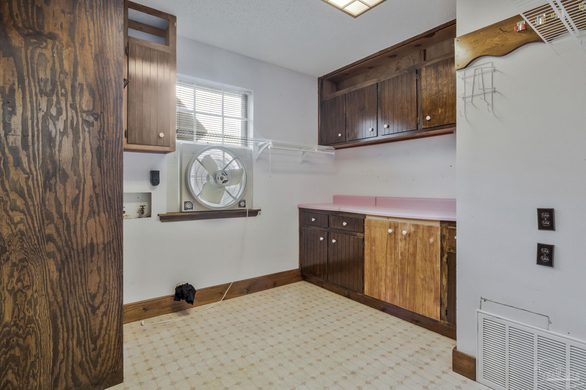 4411 Pace Lane Pace, FL 32571 - Photo 63 of 68 a bedroom with a bed and cabinets