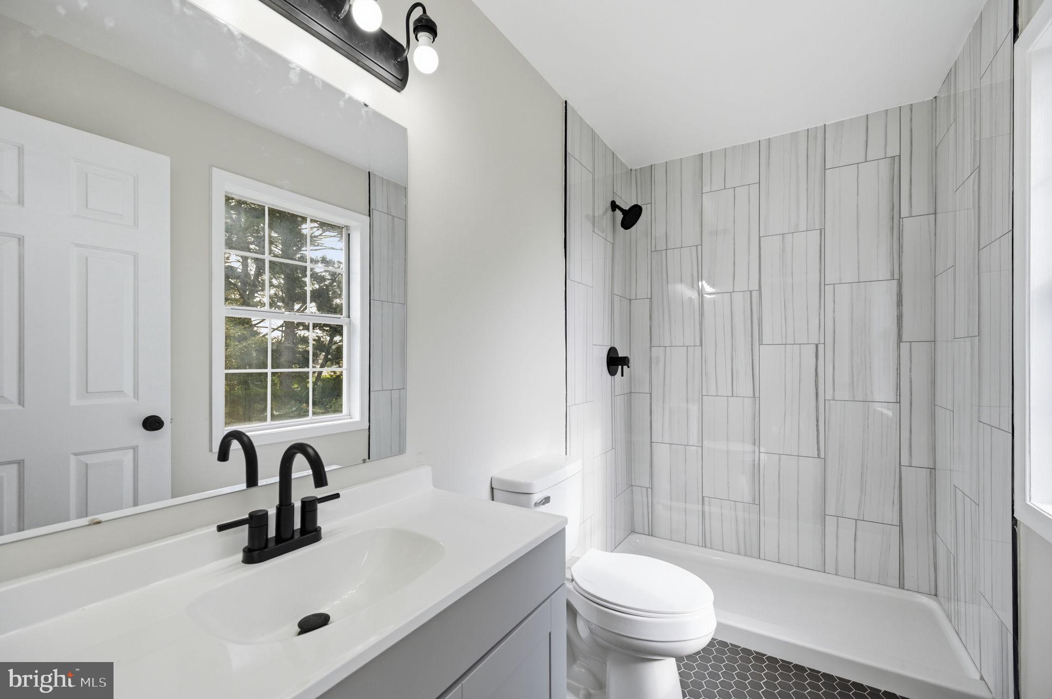672 Ripplebrook Drive Culpeper, VA 22701 - Photo 3 of 26 Modern bathroom with sleek finishes.