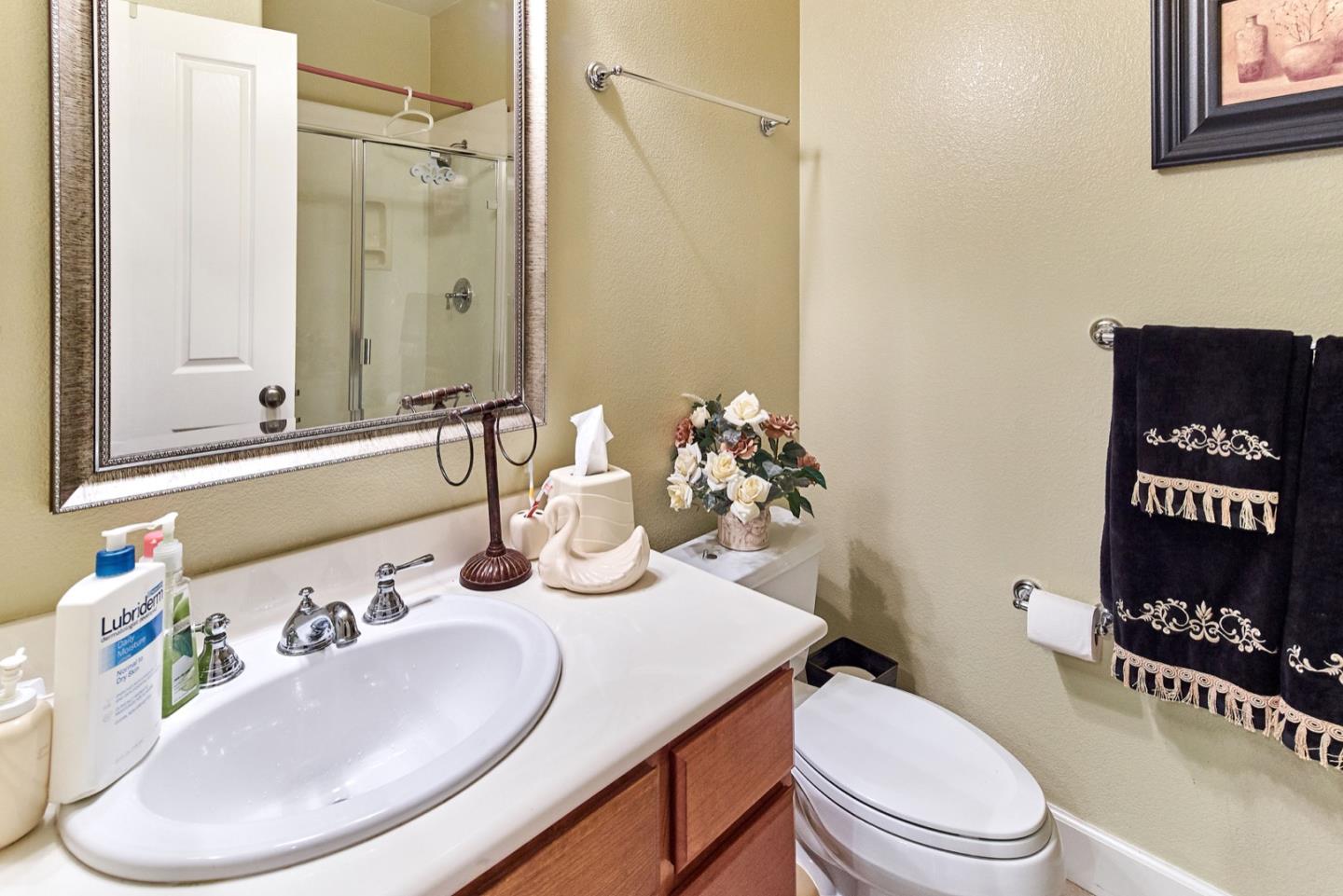 1570 Reston Terrace Sunnyvale, CA 94087 - Photo 13 of 39 a bathroom with a sink a toilet and a mirror