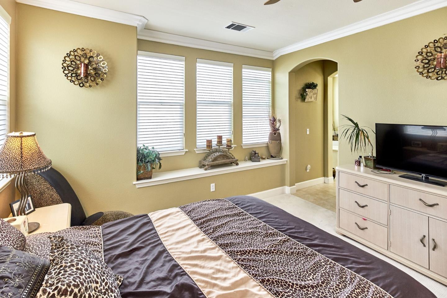 1570 Reston Terrace Sunnyvale, CA 94087 - Photo 20 of 39 a bedroom with a bed and a flat screen tv