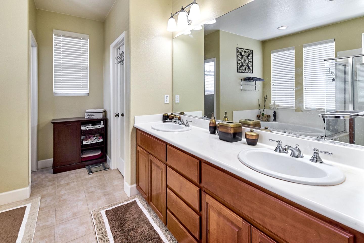 1570 Reston Terrace Sunnyvale, CA 94087 - Photo 22 of 39 a bathroom with a sink double vanity and a mirror
