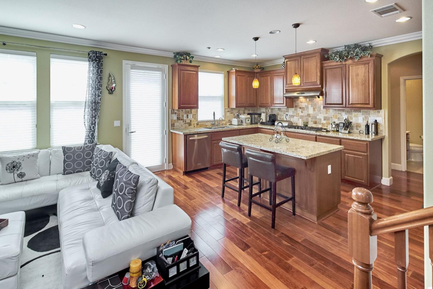 1570 Reston Terrace Sunnyvale, CA 94087 - Photo 8 of 39 a living room with stainless steel appliances granite countertop furniture and a wooden floor