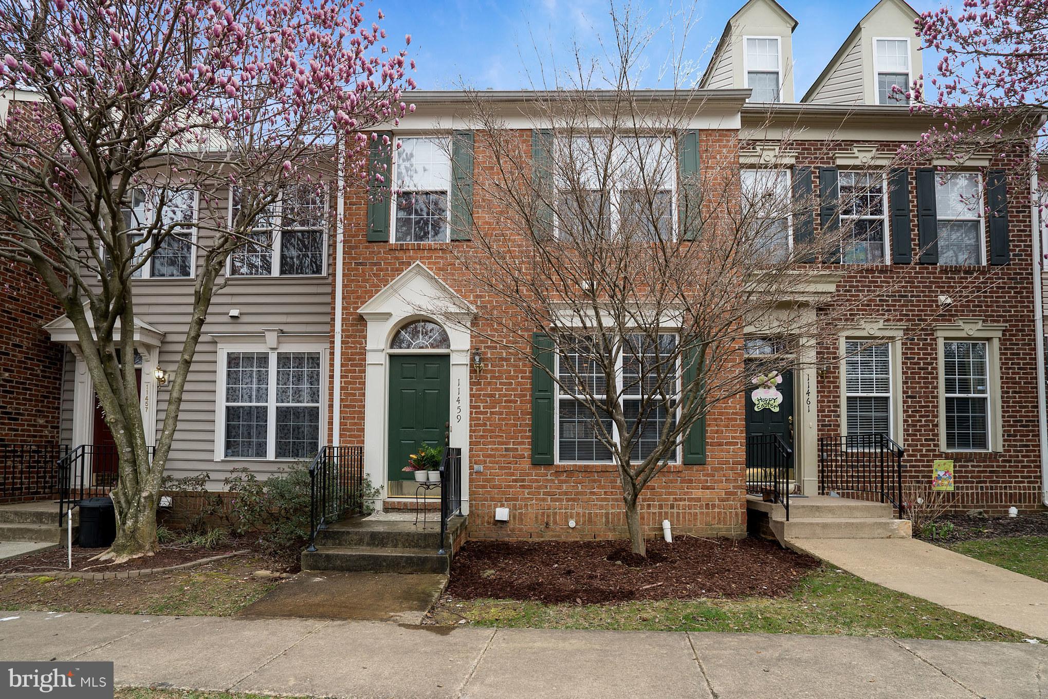 11459 Heritage Commons Way Reston, VA 20194 - Photo 1 of 30 a front view of a house