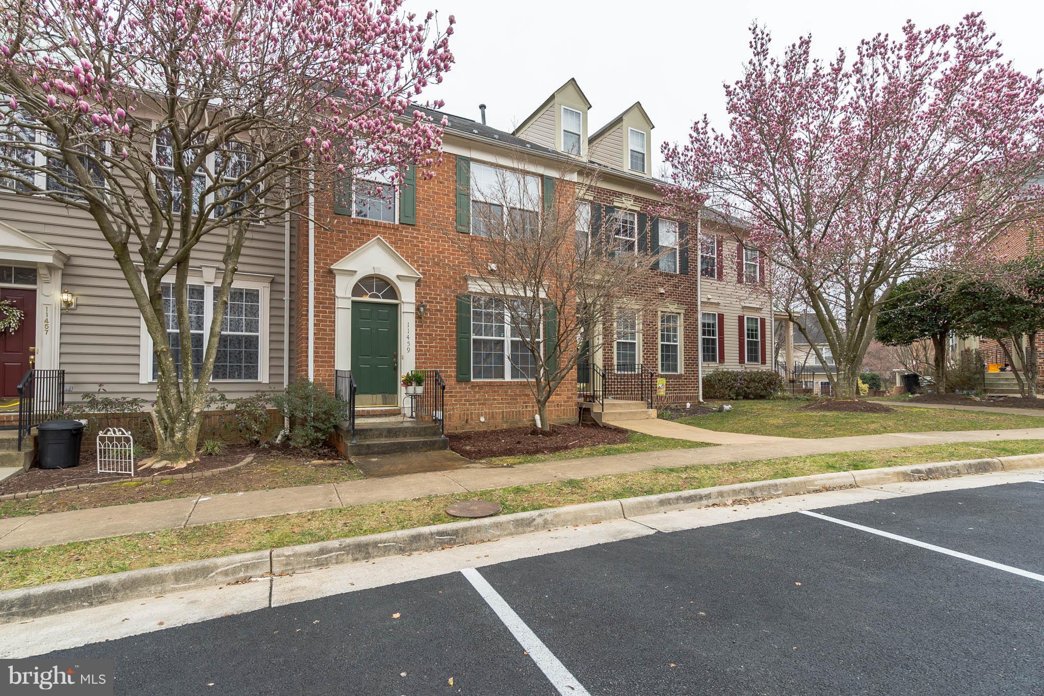 11459 Heritage Commons Way Reston, VA 20194 - Photo 2 of 30 a view of a house with a yard and large tree