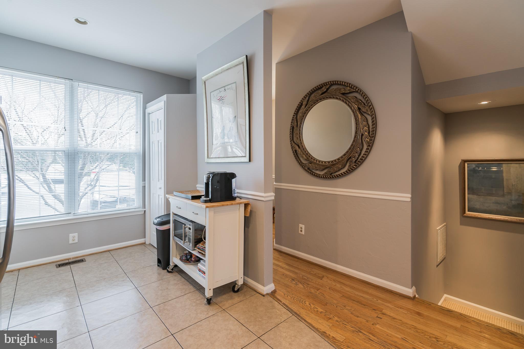 11459 Heritage Commons Way Reston, VA 20194 - Photo 11 of 30 a kitchen with a stove a sink and a window